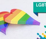 Rainbow coloured hearts featuring the word 'LGBT+ History Month' in a green banner