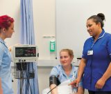 Female undergraduate student having her blood pressure checked, QMC