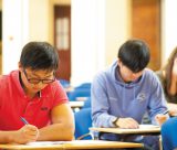 Undergraduate students sitting an exam in the Great Hall, University Park